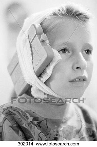 Picture - Portrait of girl with bandage and ice pack. Fotosearch