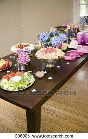 Stock Photography - Dining table with buffet food. Fotosearch