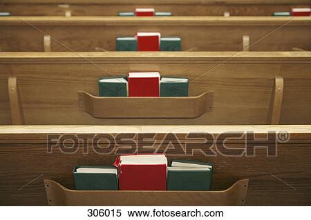 Stock Photography - Empty church pews and hymnals. Fotosearch