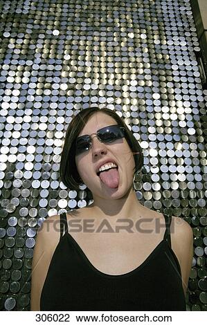 Stock Image - Woman sticking tongue out. Fotosearch