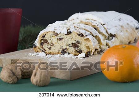Picture - A fruit cake in a Christmas setting. Fotosearch