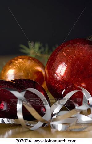 Christmas ornaments and ribbon View Large Photo Image Picture - Christmas ornaments and ribbon. Fotosearch