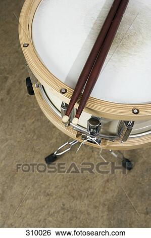 Close up of drum kit and drumsticks View Large Photo Image Stock Photograph - Close up of drum kit and drumsticks. Fotosearch