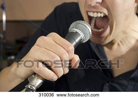 Close-up of singer View Large Photo Image Stock Photograph - Close-up of singer. Fotosearch