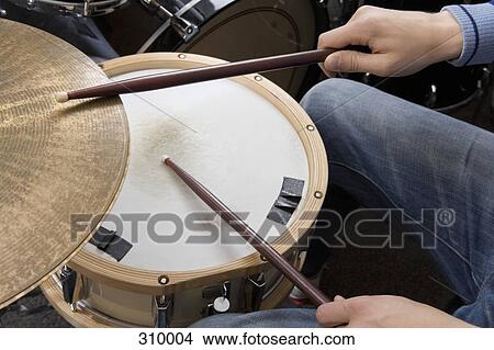 Man playing the drums View Large Photo Image Picture - Man playing the drums. Fotosearch