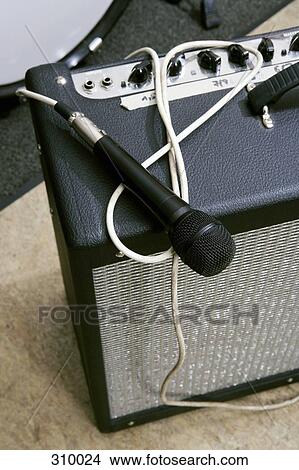 Picture - Microphone, amplifier and drum kit. Fotosearch