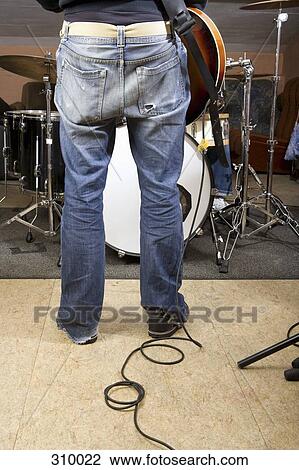 Rear view of guitarist in rock band View Large Photo Image Stock Image - Rear view of guitarist in rock band. Fotosearch