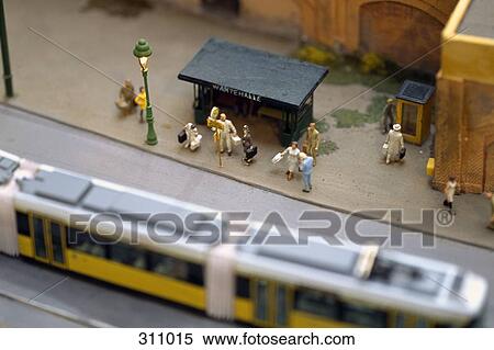 Model of commuters waiting at tram stop View Large Photo Image Stock Photography - Model of commuters waiting at tram stop. Fotosearch