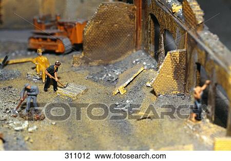 Model of manual workers demolishing building View Large Photo Image Stock Image - Model of manual workers demolishing building. Fotosearch