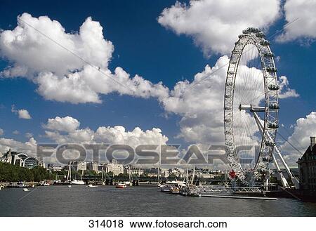 Stock Photo - Millennium Wheel next to the Thames River, London, England. Fotosearch