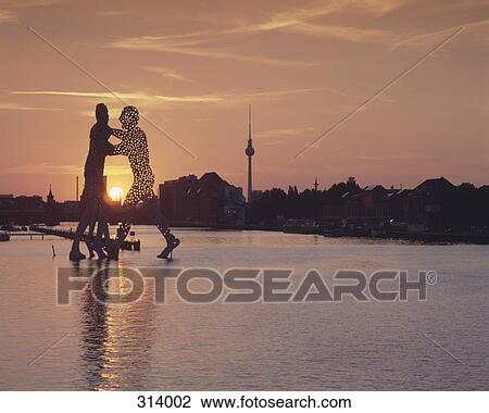 Stock Image - Molecule Man sculpture on Spree River, Berlin, Germany. Fotosearch