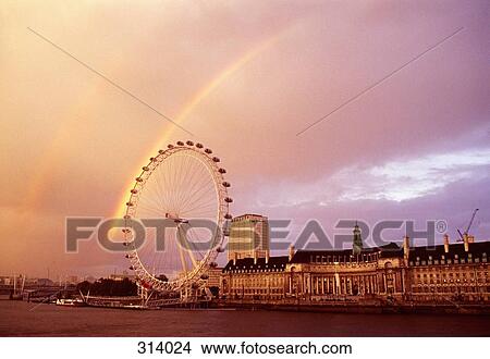 Rainbow in sky above Millennium Wheel and County Hall, London, England View Large Photo Image Picture - Rainbow in sky above Millennium Wheel and County Hall, London, England. Fotosearch