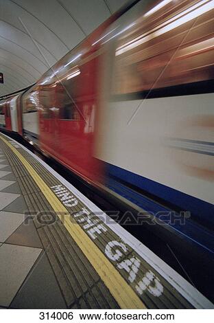 Train moving through Underground station, London, England View Large Photo Image Stock Photograph - Train moving through Underground station, London, England. Fotosearch