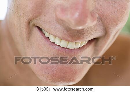 Stock Image - Close of man’s mouth smiling. Fotosearch