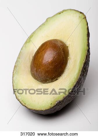 Stock Image - Cross section of an avocado. Fotosearch