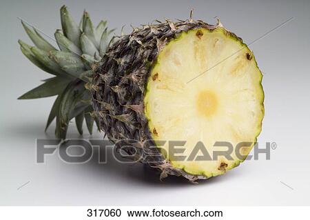Pineapple cut in half View Large Photo Image Stock Image - Pineapple cut in half. Fotosearch