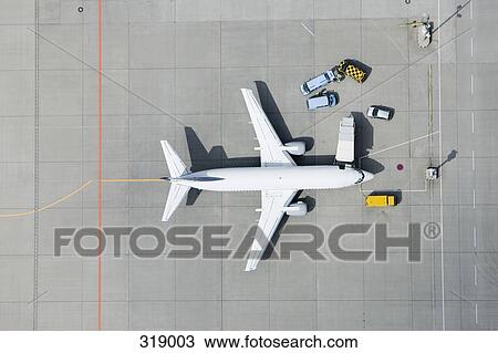 Aerial view of airplane and vans View Large Photo Image Stock Image - Aerial view of airplane and vans. Fotosearch