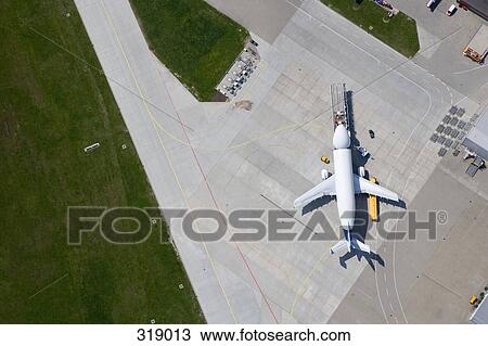 Aerial view of airplane on tarmac View Large Photo Image Stock Image - Aerial view of airplane on tarmac. Fotosearch