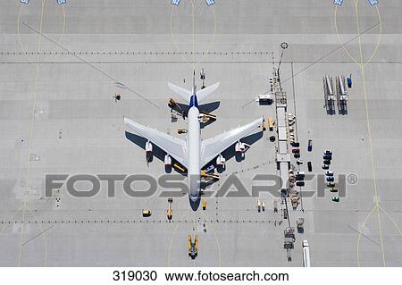 Aerial view of airplane on tarmac View Large Photo Image Stock Image - Aerial view of airplane on tarmac. Fotosearch