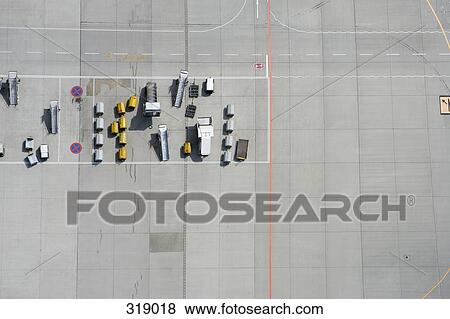 Aerial view of tarmac markings and equipment at airport View Large Photo Image Stock Photo - Aerial view of tarmac markings and equipment at airport. Fotosearch