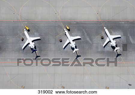 Aerial view of three airplanes in a row View Large Photo Image Stock Image - Aerial view of three airplanes in a row. Fotosearch