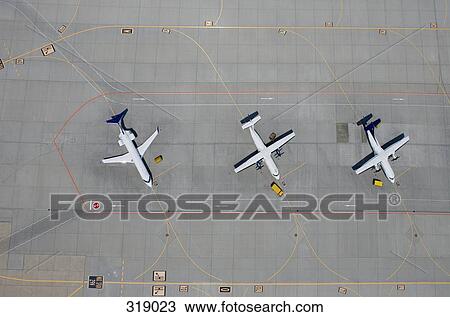 Aerial view of three parked airplanes View Large Photo Image Stock Image - Aerial view of three parked airplanes. Fotosearch