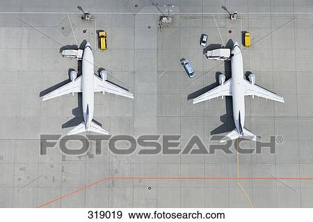 Aerial view of two airplanes on tarmac View Large Photo Image Stock Photo - Aerial view of two airplanes on tarmac. Fotosearch