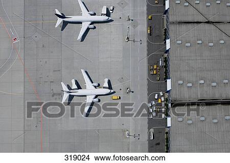 Aerial view of two parked airplanes View Large Photo Image Picture - Aerial view of two parked airplanes. Fotosearch