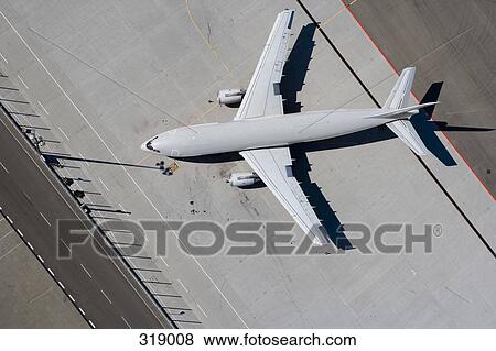 Aerial view of yellow airplane View Large Photo Image Stock Photo - Aerial view of yellow airplane. Fotosearch
