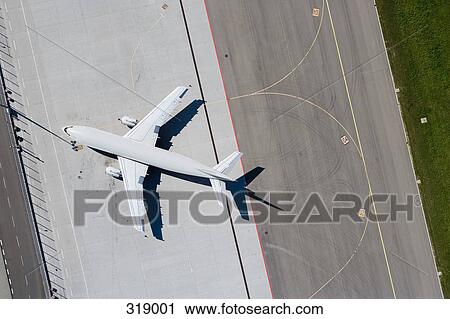 Stock Image - Airplane on tarmac at an airport. Fotosearch