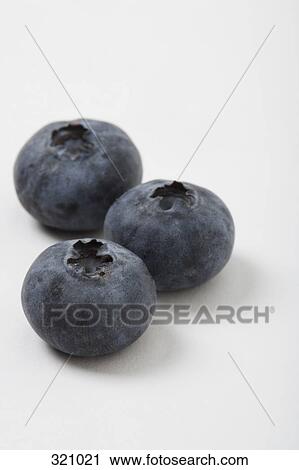 Close-up of three blueberries View Large Photo Image Stock Image - Close-up of three blueberries. Fotosearch