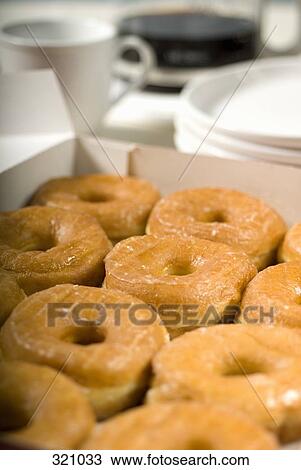 Stock Image - Donuts in a box. Fotosearch