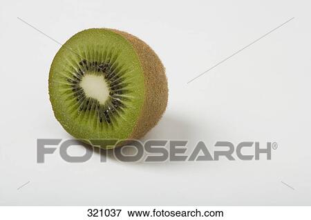 Kiwi fruit cut in half View Large Photo Image Stock Photo - Kiwi fruit cut in half. Fotosearch