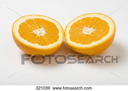 Two halves of an orange View Large Photo Image Stock Photo - Two halves of an orange. Fotosearch