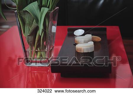 Candles on wooden tray next to vase of flowers View Large Photo Image Stock Image - Candles on wooden tray next to vase of flowers. Fotosearch