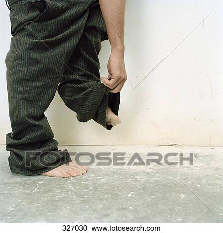Man taking his pants off View Large Photo Image Stock Image - Man taking his pants off. Fotosearch