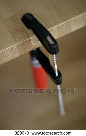 Clamp attached to wooden bench View Large Photo Image Stock Image - Clamp attached to wooden bench. Fotosearch