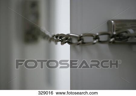 Stock Photograph - Close-up of chain across doorway. Fotosearch
