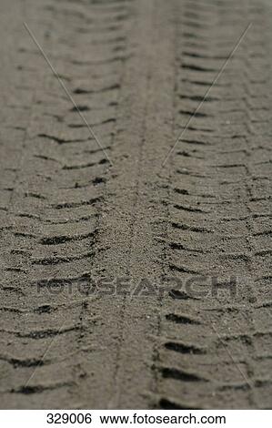 Close-up of tire track in sand View Large Photo Image Stock Photograph - Close-up of tire track in sand. Fotosearch