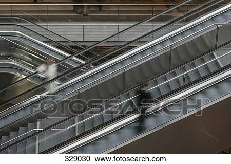 People moving up escalator View Large Photo Image Stock Image - People moving up escalator. Fotosearch