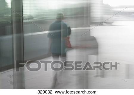 View through glass of woman on sidewalk View Large Photo Image Stock Image - View through glass of woman on sidewalk. Fotosearch