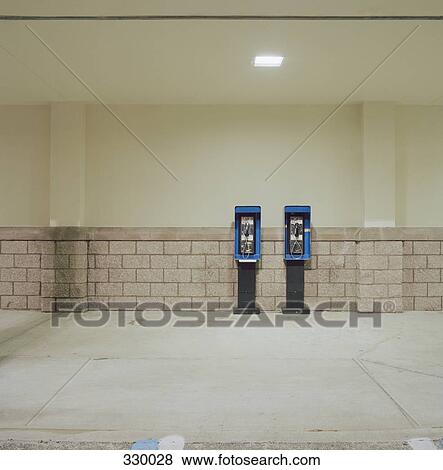 Two public phones side by side View Large Photo Image Stock Photo - Two public phones side by side. Fotosearch