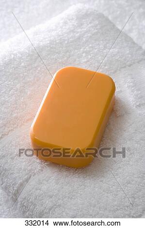 Bar of soap and towel View Large Photo Image Picture - Bar of soap and towel. Fotosearch