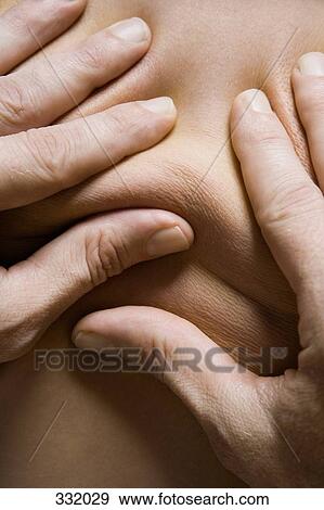 Hands massaging back View Large Photo Image Stock Photo - Hands massaging back. Fotosearch