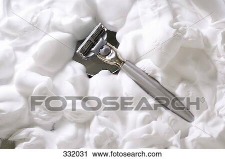 Stock Image - Razor and shaving cream. Fotosearch