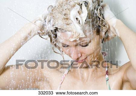 Woman washing her hair in the shower View Large Photo Image Stock Image - Woman washing her hair in the shower. Fotosearch