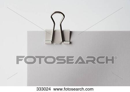 Binder clip on document View Large Photo Image Picture - Binder clip on document. Fotosearch