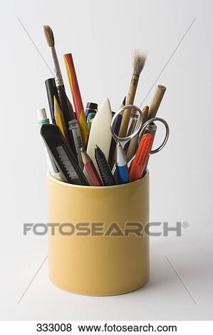 Stock Photo - Container full of stationery. Fotosearch