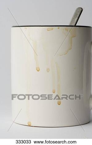 Stock Image - Drips on side of white can. Fotosearch