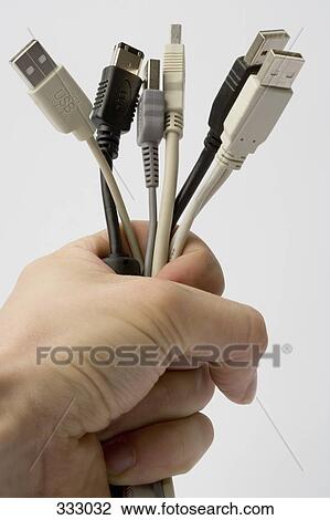 Man holding USB connector cables View Large Photo Image Stock Image - Man holding USB connector cables. Fotosearch